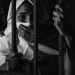 grayscale photography of woman inside jail