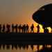 soldiers in line to get in a plane